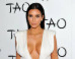 Kim Kardashian Celebrates Her Birthday In A Plunging White Dress